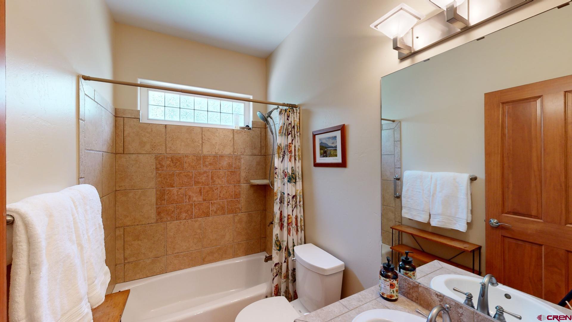 222 Jenkins Ranch Road Durango, CO 81301 - Photo 23 of 30 a bathroom with a toilet and a shower