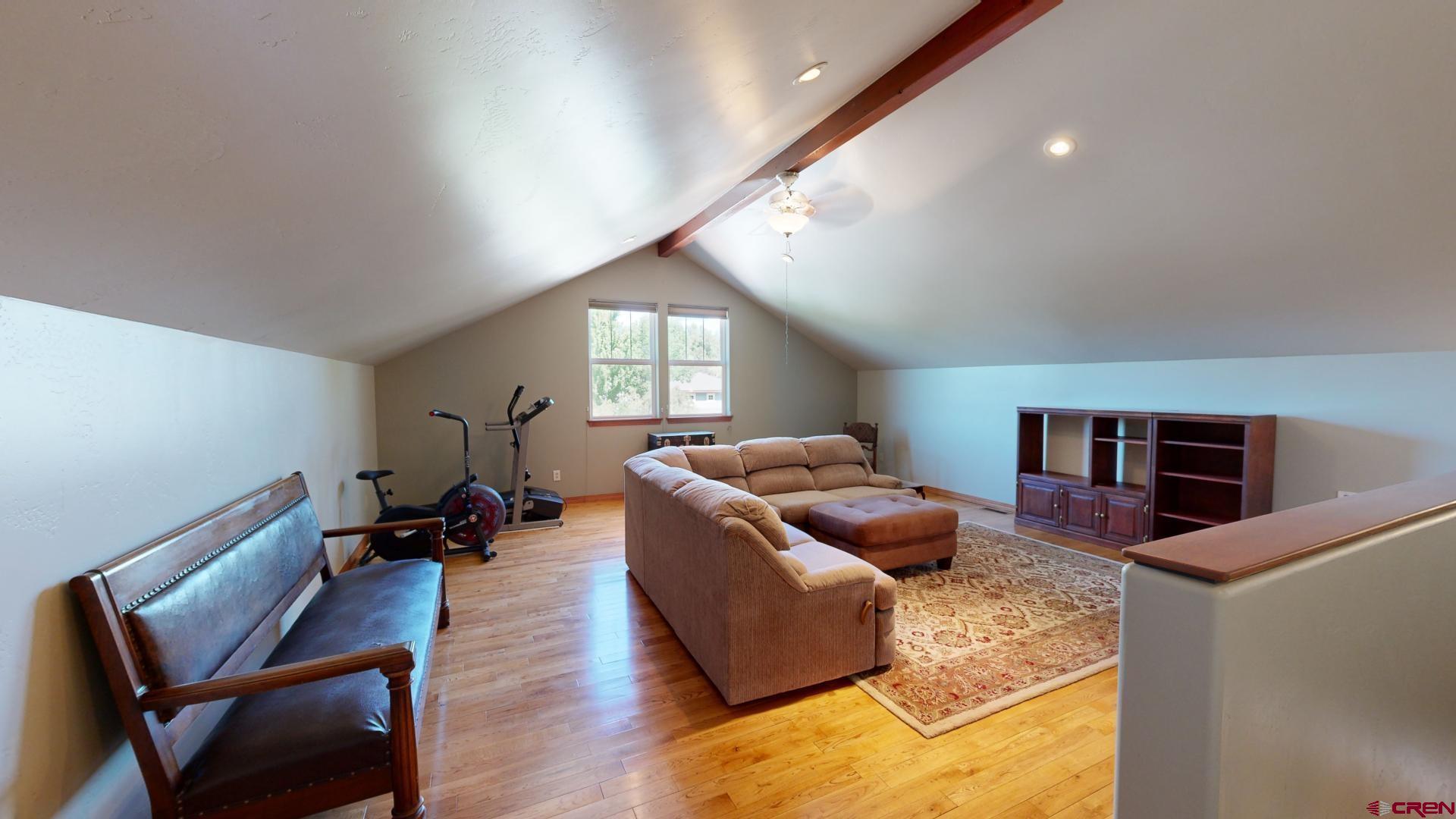 222 Jenkins Ranch Road Durango, CO 81301 - Photo 25 of 30 a living room with furniture and a wooden floor