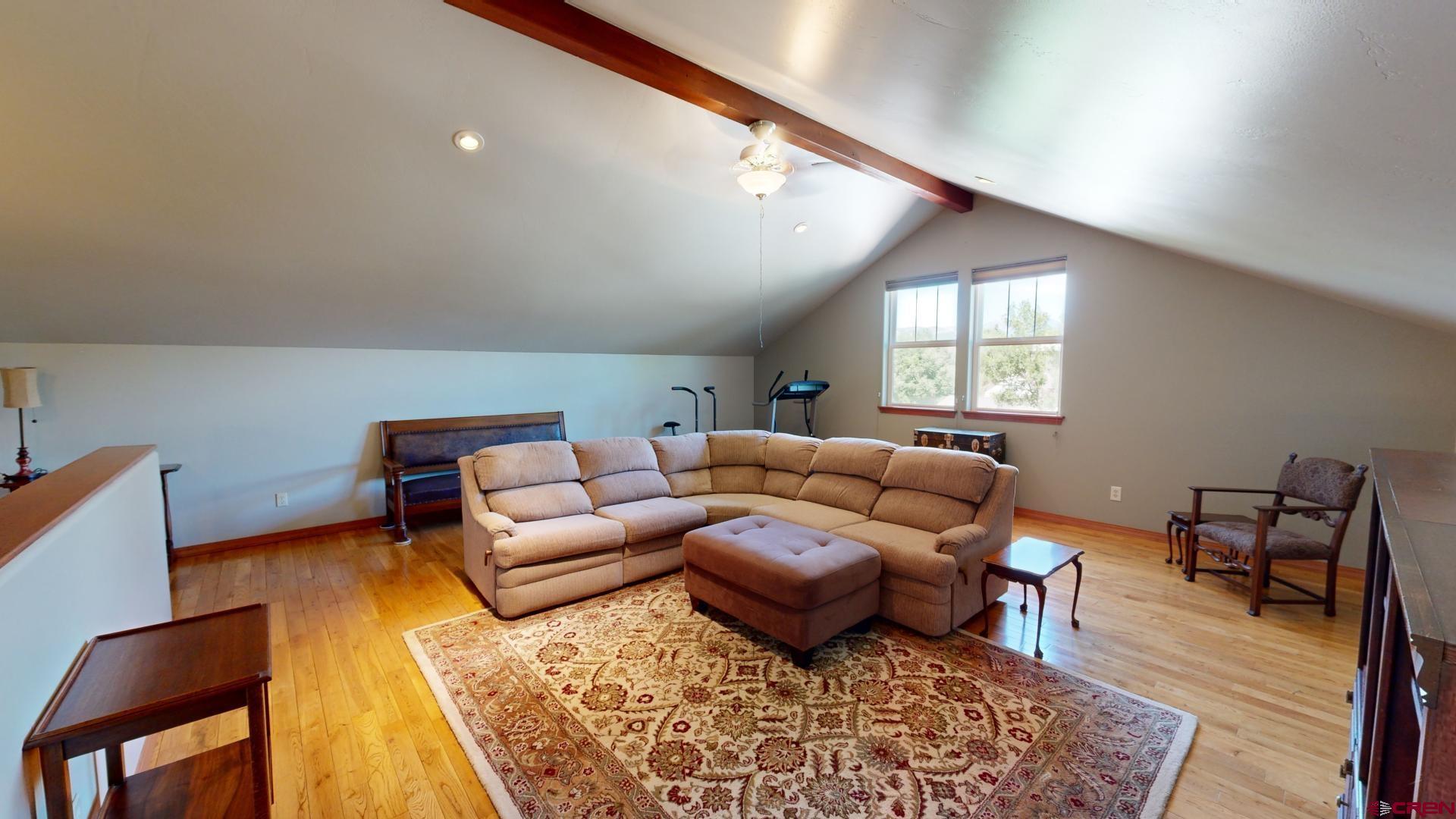 222 Jenkins Ranch Road Durango, CO 81301 - Photo 28 of 30 a living room with furniture and wooden floor