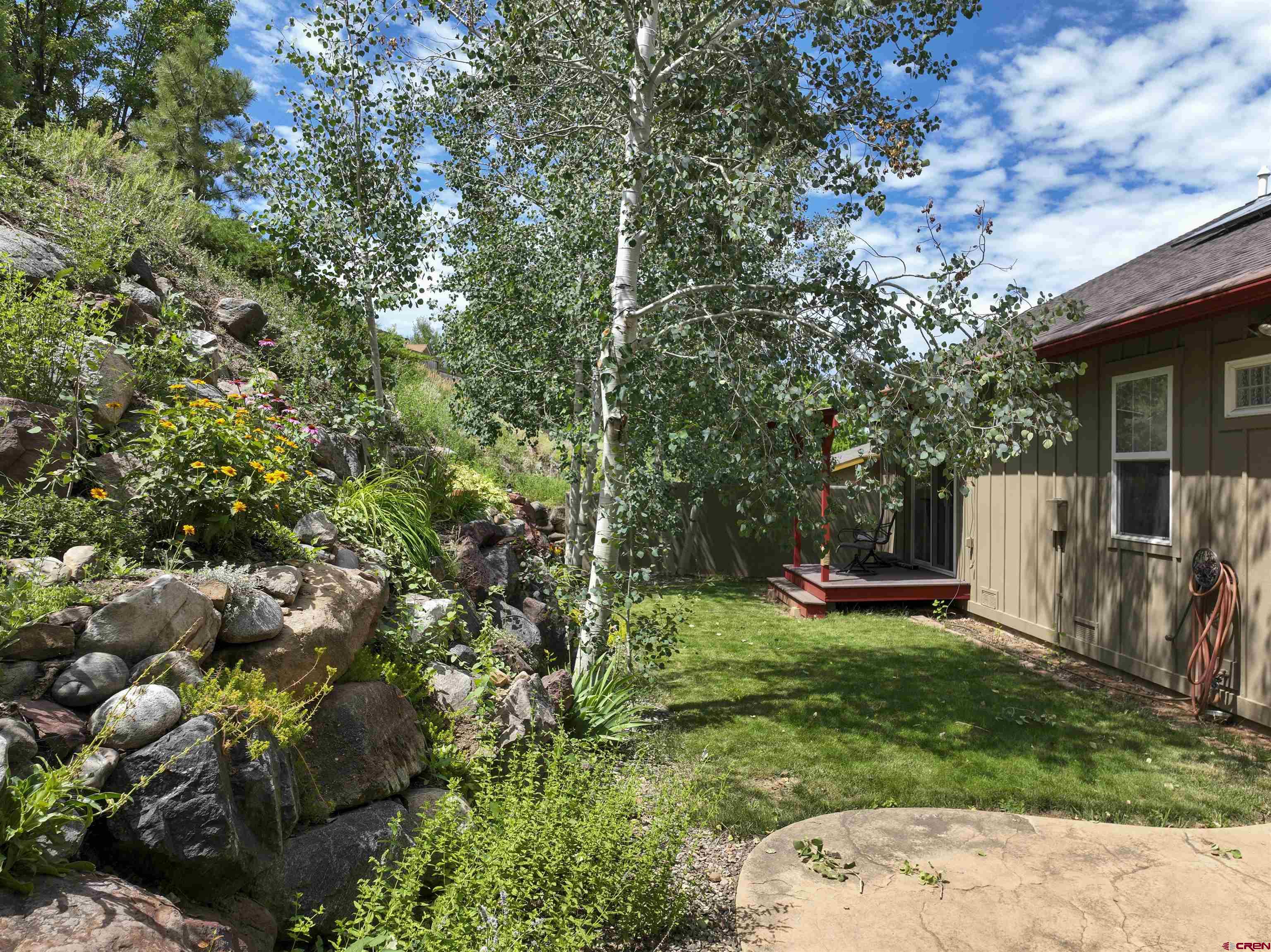 222 Jenkins Ranch Road Durango, CO 81301 - Photo 5 of 30 a view of backyard with plants and trees