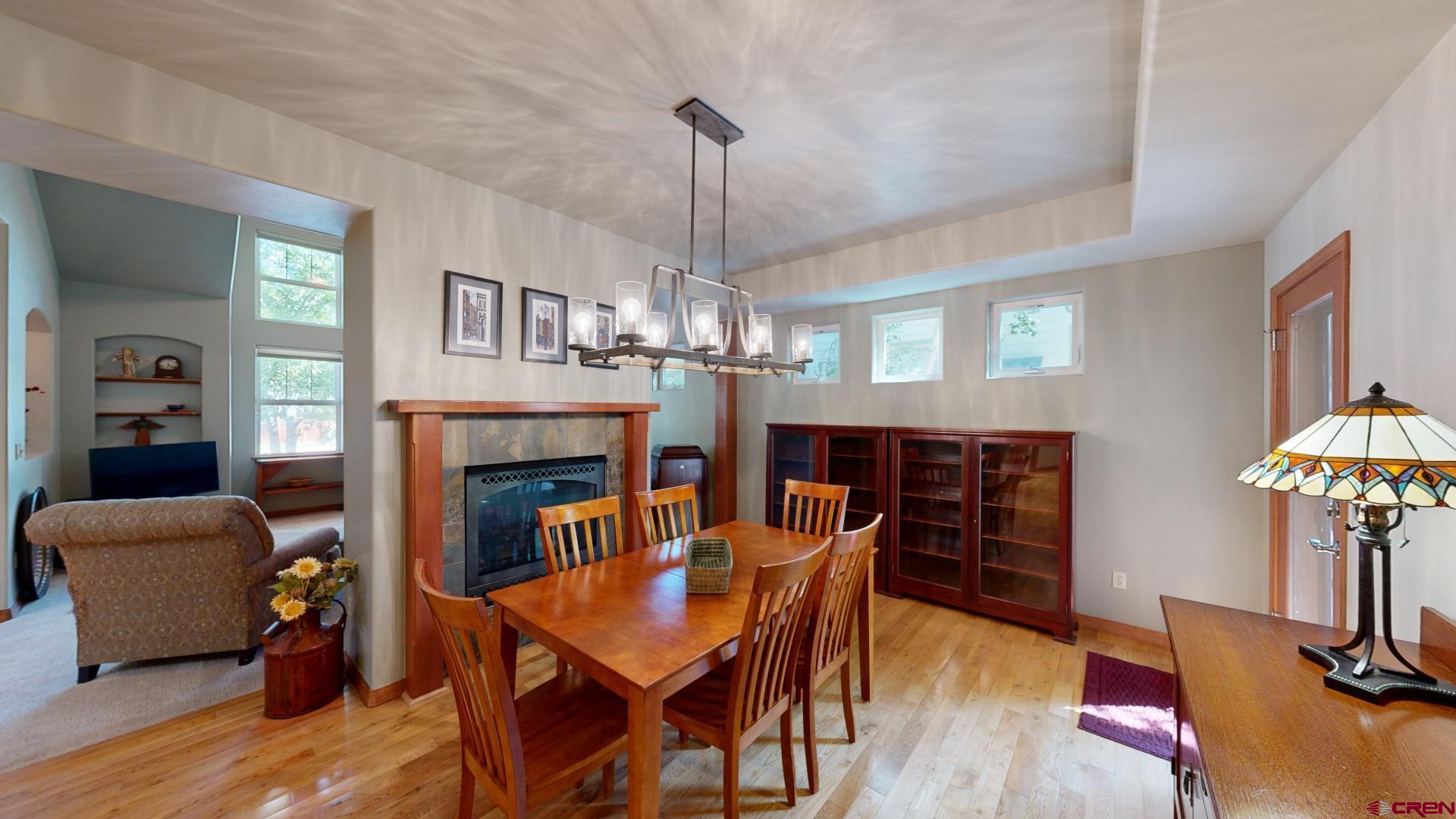222 Jenkins Ranch Road Durango, CO 81301 - Photo 6 of 30 a dining room with furniture a chandelier and wooden floor