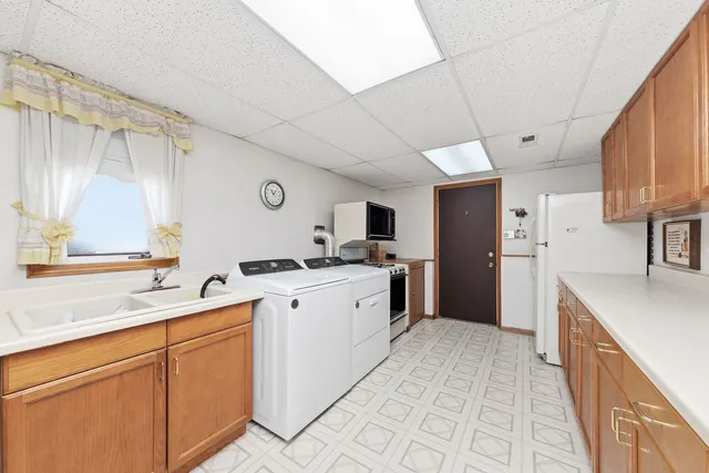 a kitchen with cabinets and sink