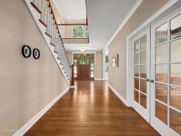 a view of an entryway with wooden floor