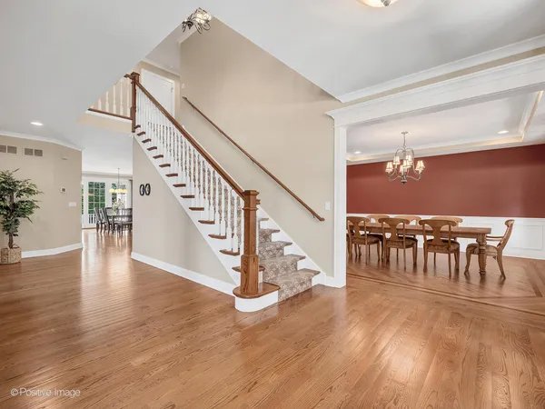 a view of dining room with furniture and wooden floor