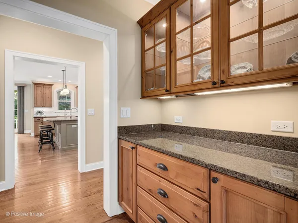 a kitchen with stainless steel appliances granite countertop a sink and cabinets