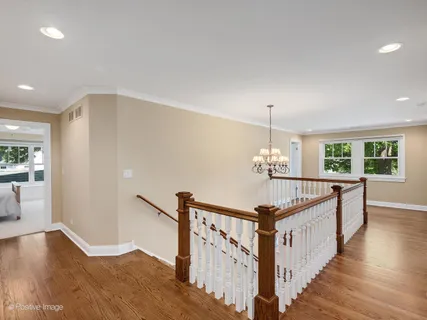 a view of a hallway with windows