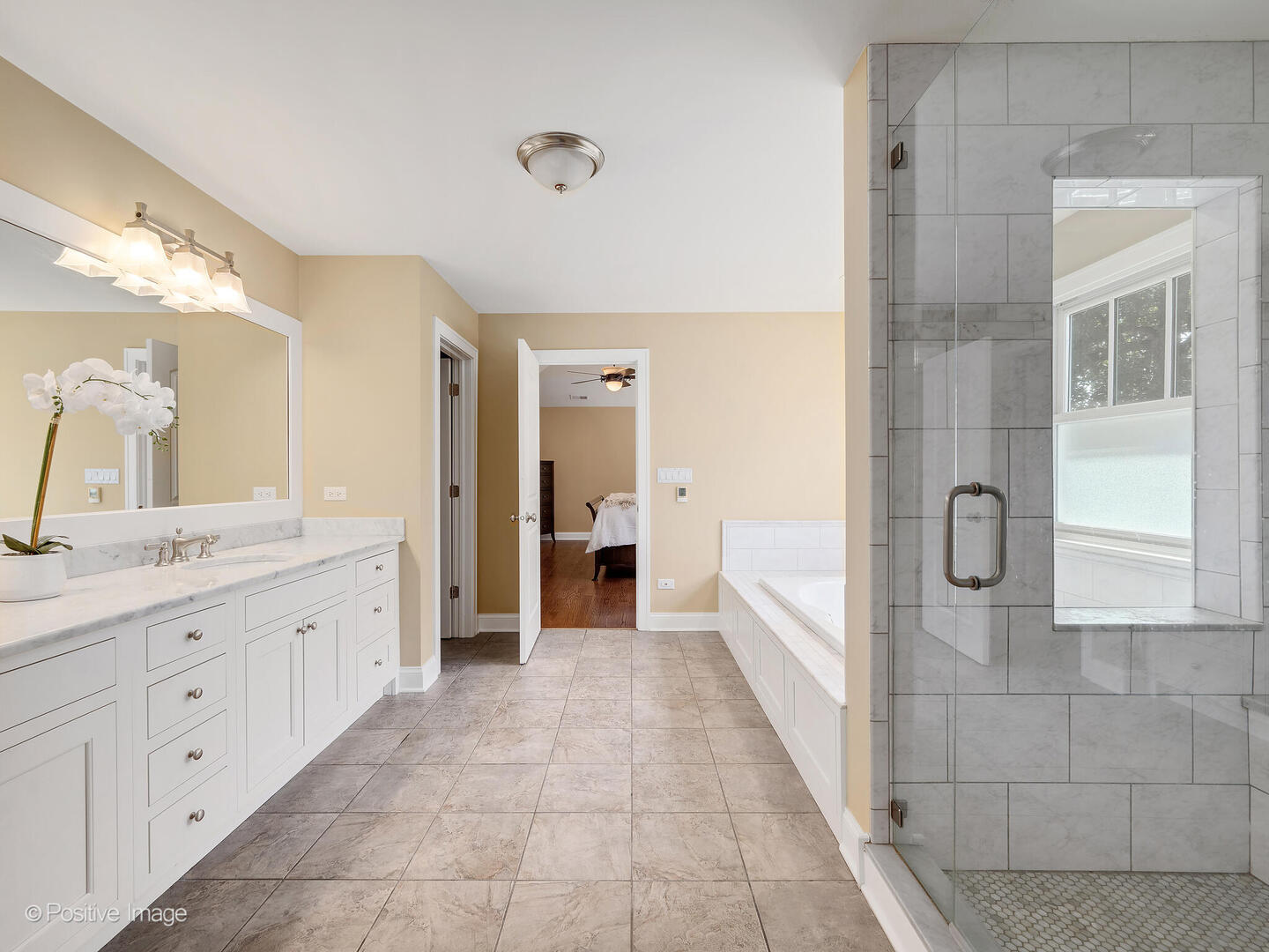 610 Washington Street Elmhurst, IL 60126 - Photo 36 of 48 a bathroom with a granite countertop sink a mirror and a bathtub