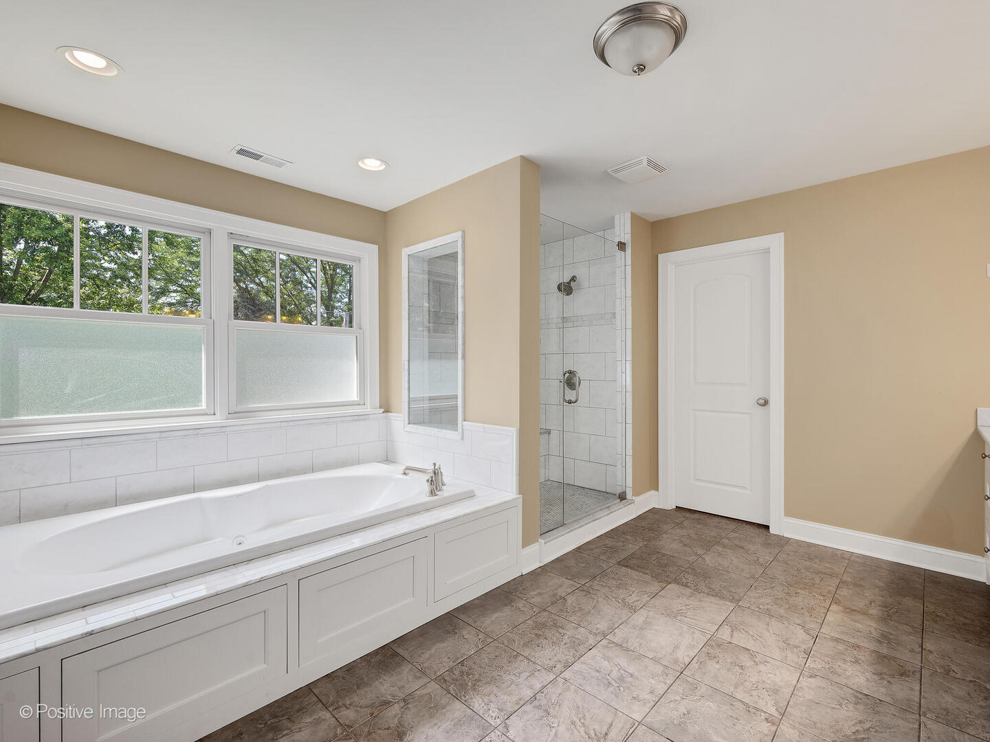 610 Washington Street Elmhurst, IL 60126 - Photo 37 of 48 a spacious bathroom with a tub shower and sink