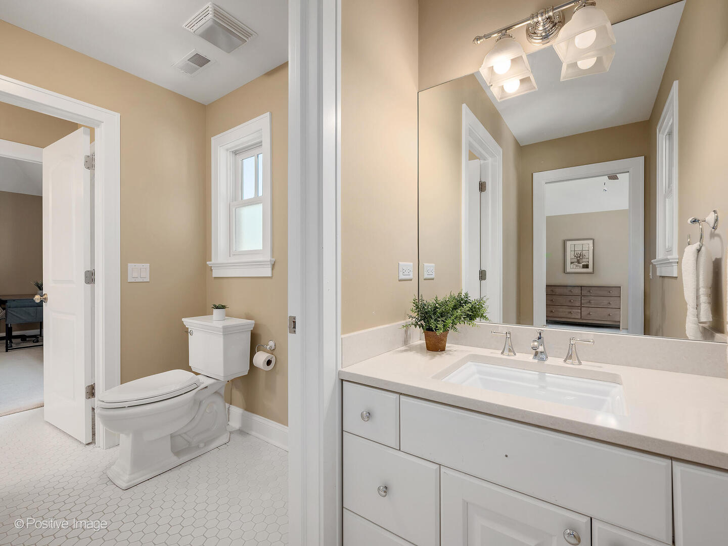 610 Washington Street Elmhurst, IL 60126 - Photo 39 of 48 a bathroom with a toilet sink and mirror