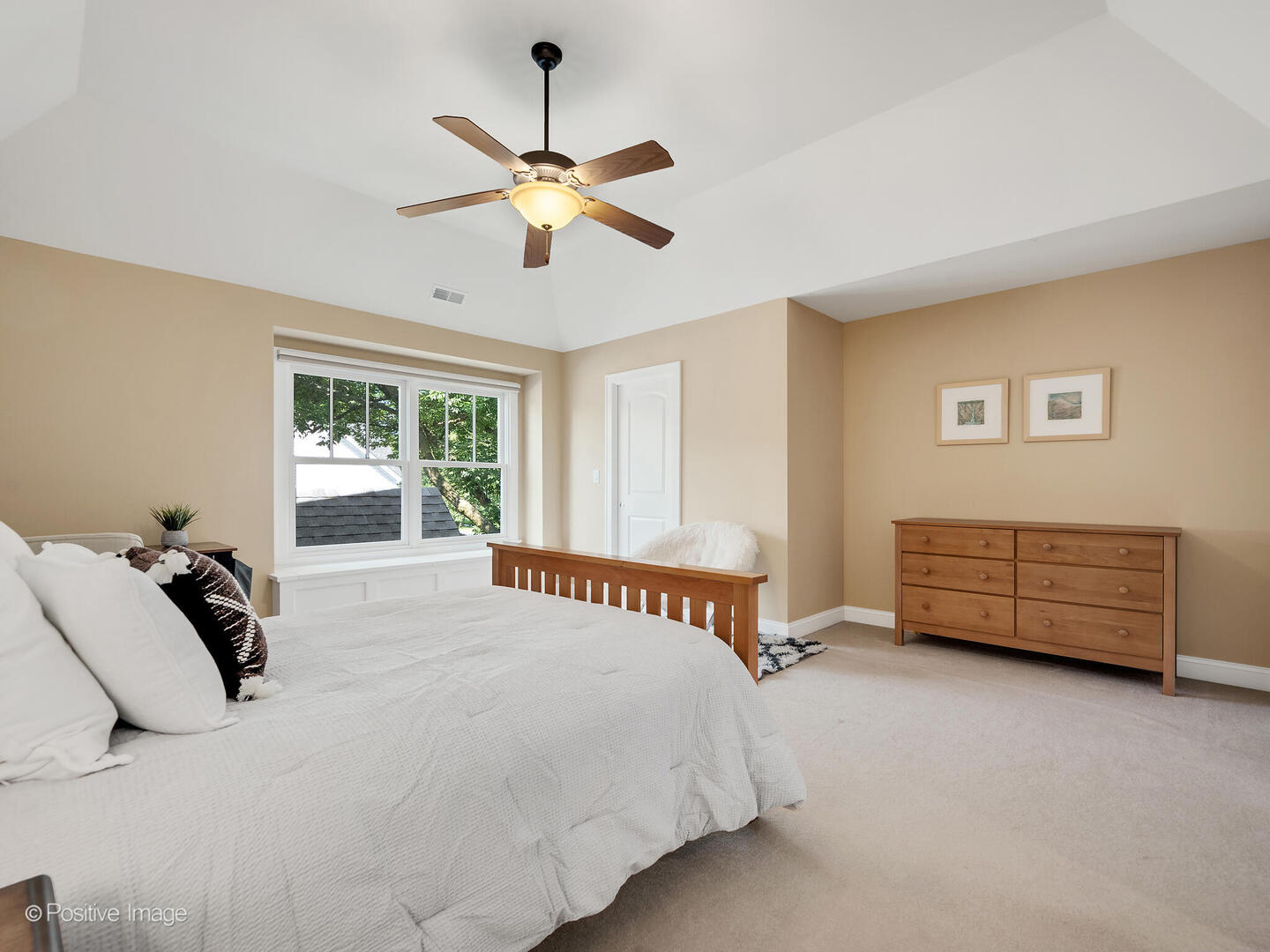 610 Washington Street Elmhurst, IL 60126 - Photo 41 of 48 a bedroom with a bed a chandelier and a window