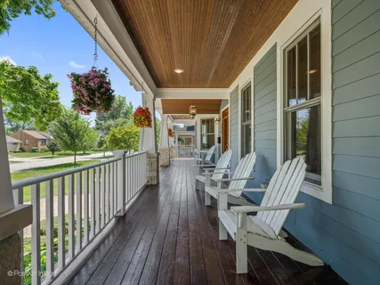 a view of balcony with furniture and wooden deck