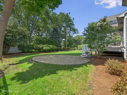 a view of a patio with a yard