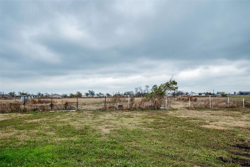 458 County Road 2131 Valley View, TX 76272 - Photo 13 of 13 Partially fenced section of the backyard shown, with the yard continuing further to encompass the full acreage.