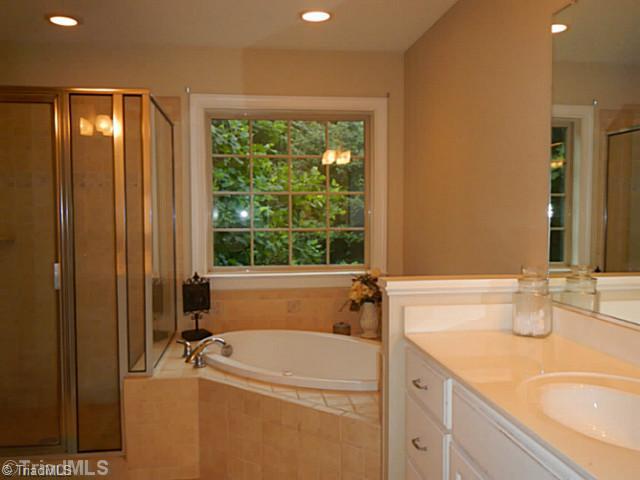 7807 Wilson Farm Road Summerfield, NC 27358 - Photo 11 of 16 Exterior Front. Master bathroom with jetted tub and separate shower and water closet.