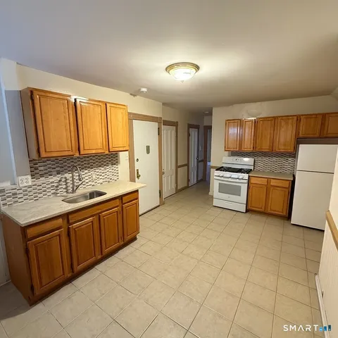 a large kitchen with a cabinets and appliances