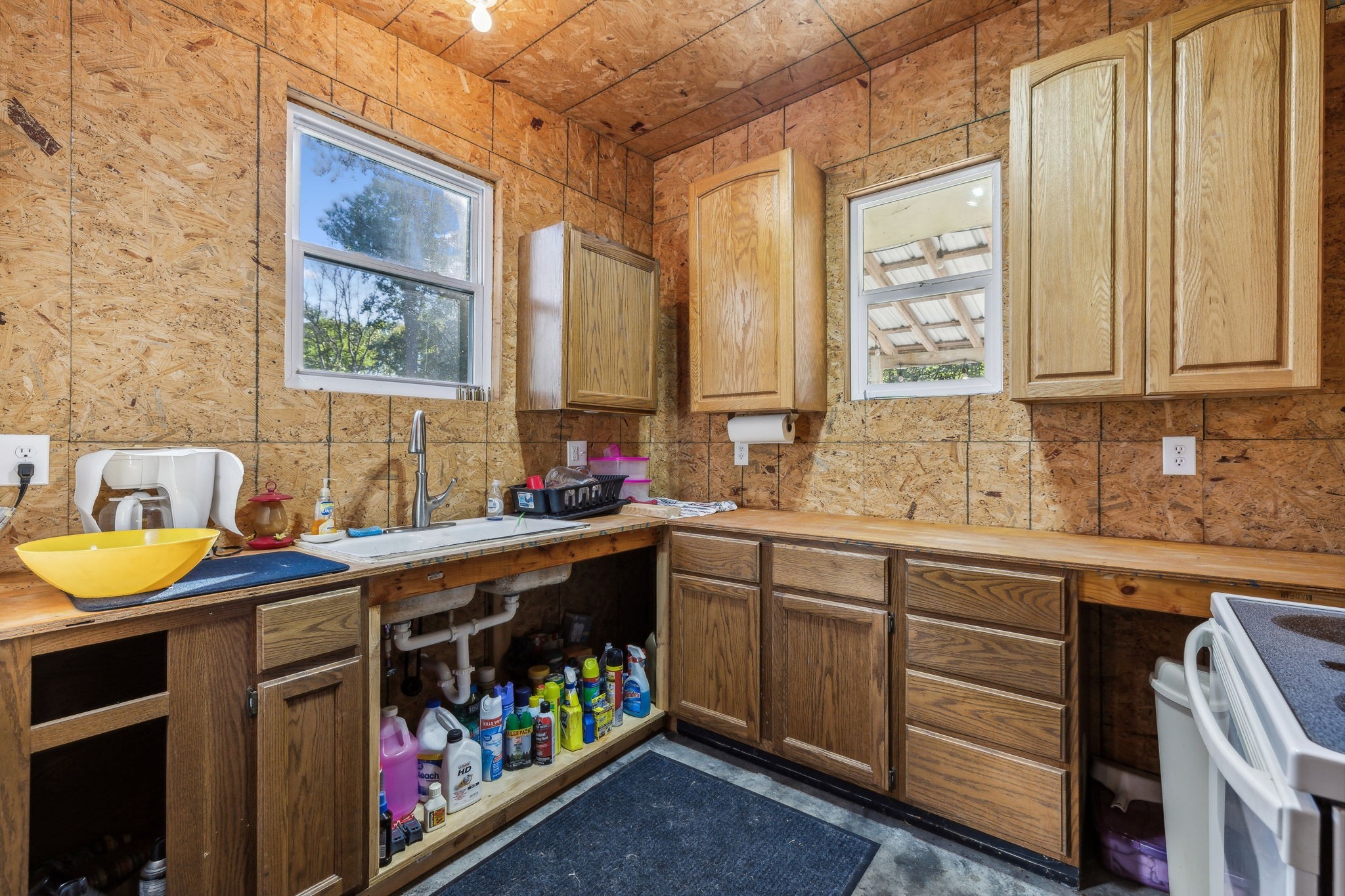 534 Whitney Branch Road Springville, TN 38256 - Photo 16 of 41 a kitchen that has a sink and a stove in it