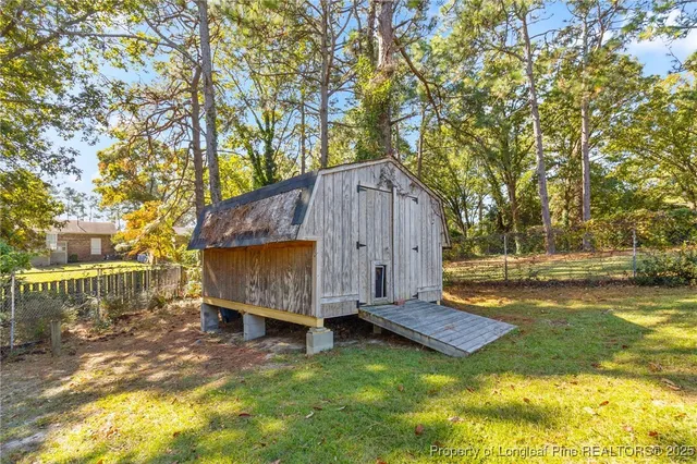 a view of backyard with tub and trees