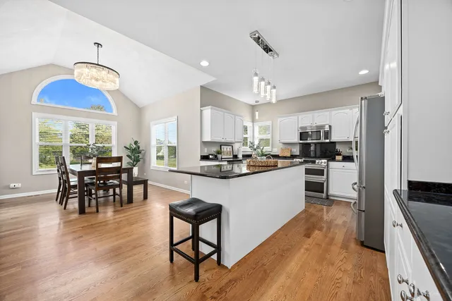 a view of a livingroom with furniture window and wooden floor