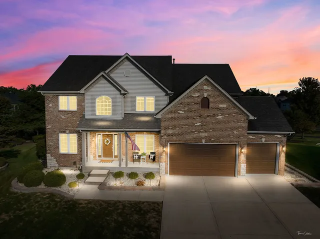 a front view of a house with yard