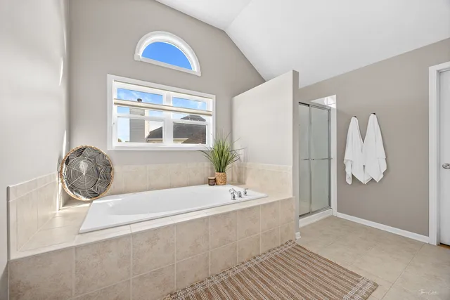 a bathroom with a granite countertop sink a mirror and a shower