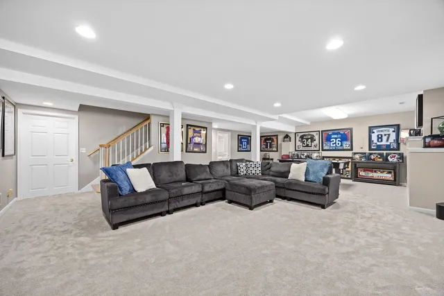 a kitchen with a dining table chairs and a flat screen tv
