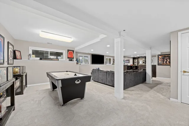 a bathroom with a granite countertop sink a toilet and a mirror