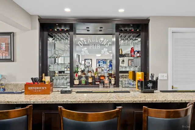 a bathroom with a sink a mirror and a shower