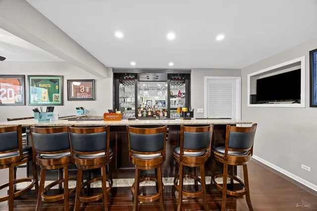 a view of a big house with a big yard and large trees