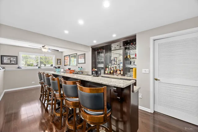 a view of a house with a yard patio and fire pit