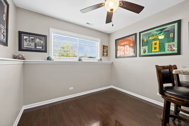 an aerial view of a house with a yard and trees