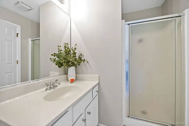 an aerial view of a house with a garden and plants