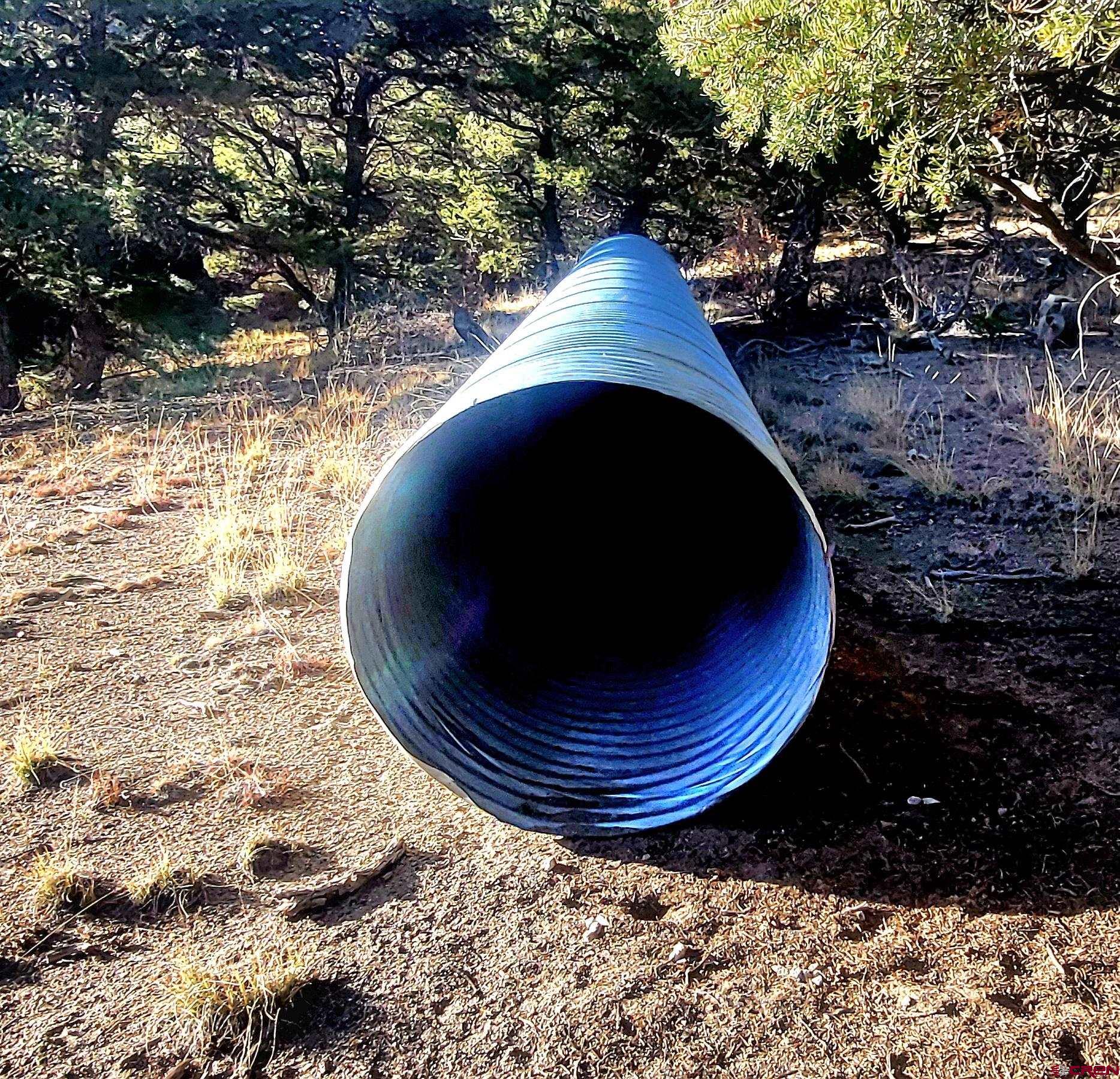 1094-1343 Valley View Road South Fork, CO 81154 - Photo 15 of 37 a view of a backyard of a house with table and chairs