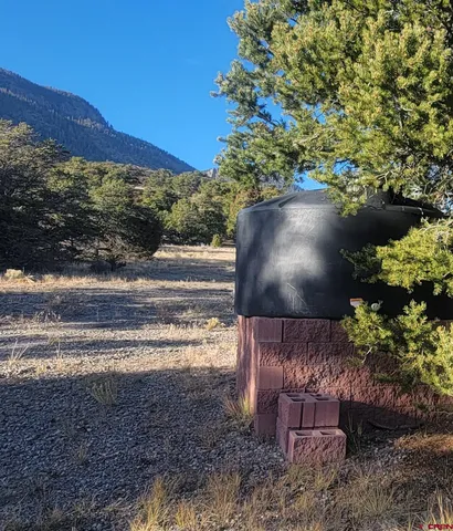 a view of a garden with a lake
