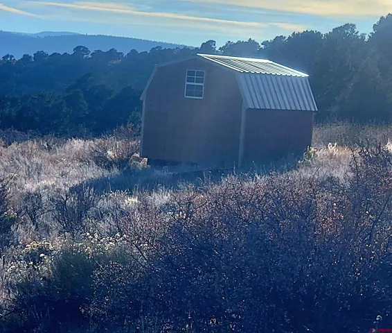a view of a large building with a mountain in the background