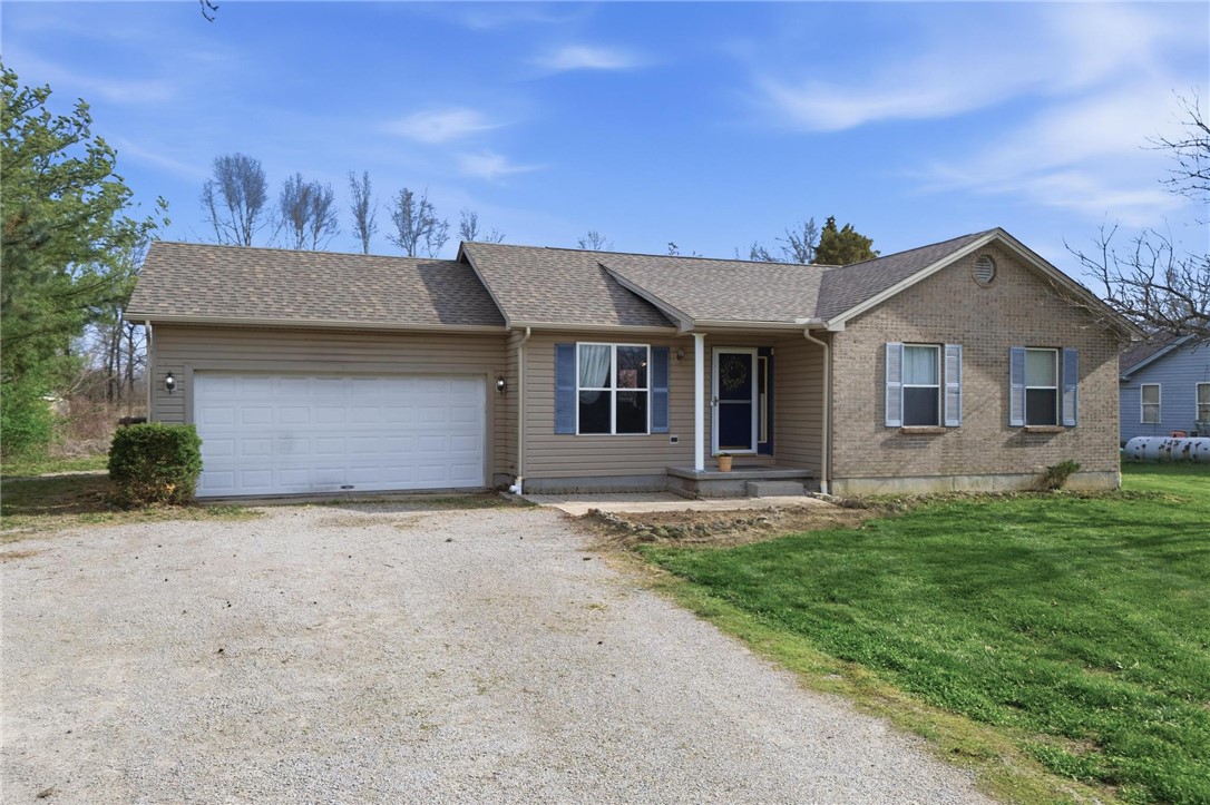 8747 Waynes Way Blanchester, OH 45107 - Photo 27 of 40 This residence features a welcoming exterior with a blend of siding and brick accents.