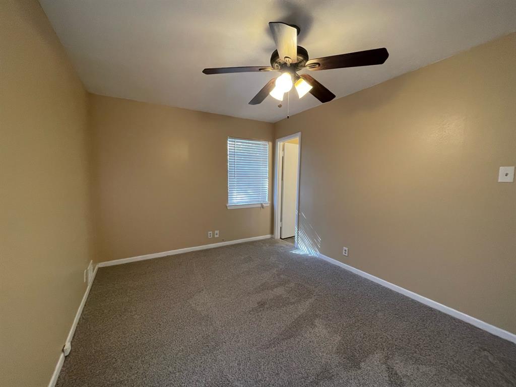 2310 Gilbert Circle Arlington, TX 76010 - Photo 5 of 9 Carpeted empty room featuring ceiling fan
