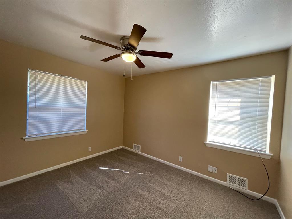2310 Gilbert Circle Arlington, TX 76010 - Photo 9 of 9 Empty room featuring carpet flooring and ceiling fan