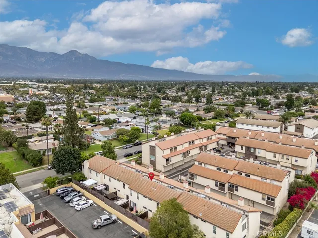 an aerial view of residential houses with outdoor space