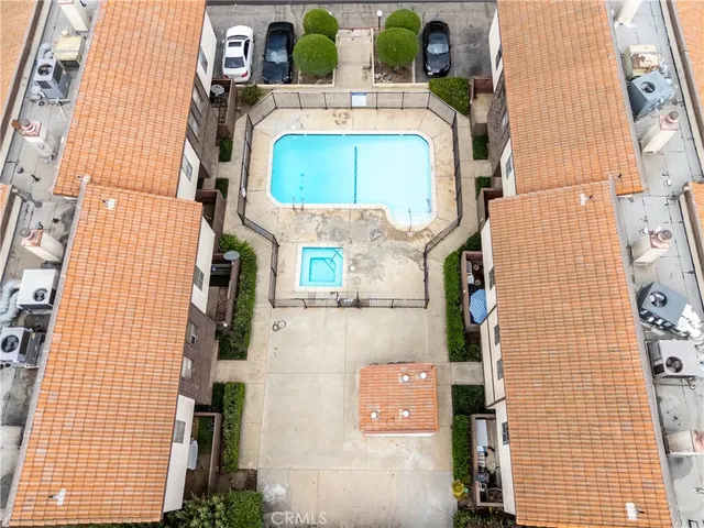 a kitchen with stainless steel appliances a stove and white cabinets