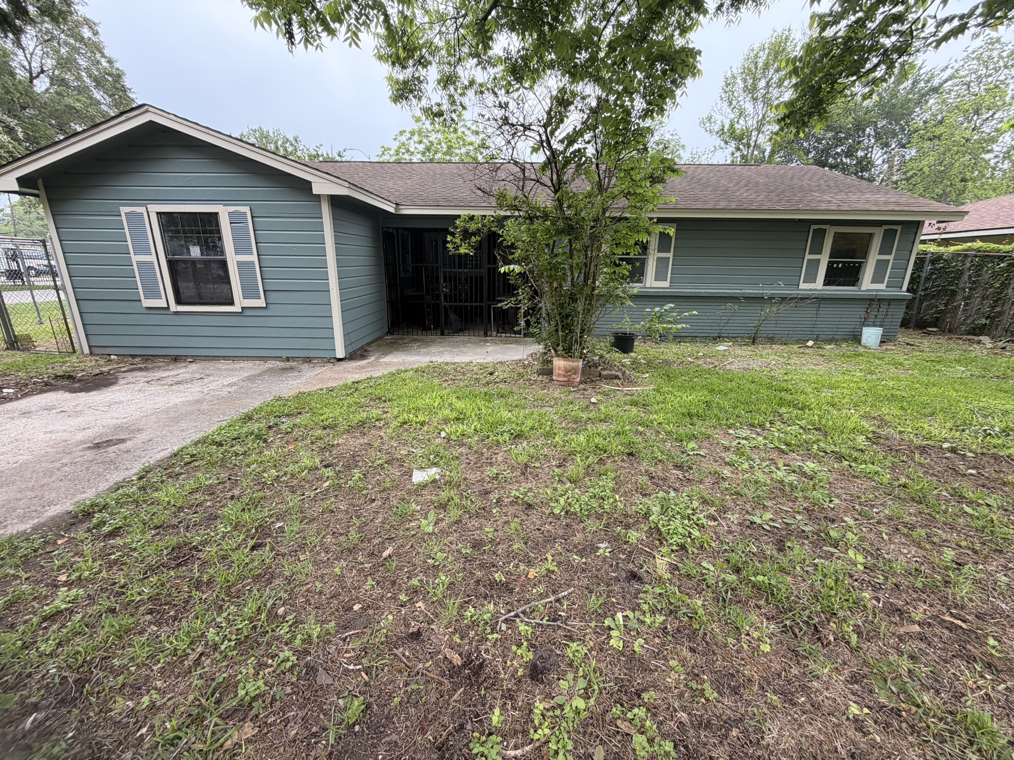222 East John Alber Road Houston, TX 77037 - Photo 2 of 21 a front view of a house with a yard and garage