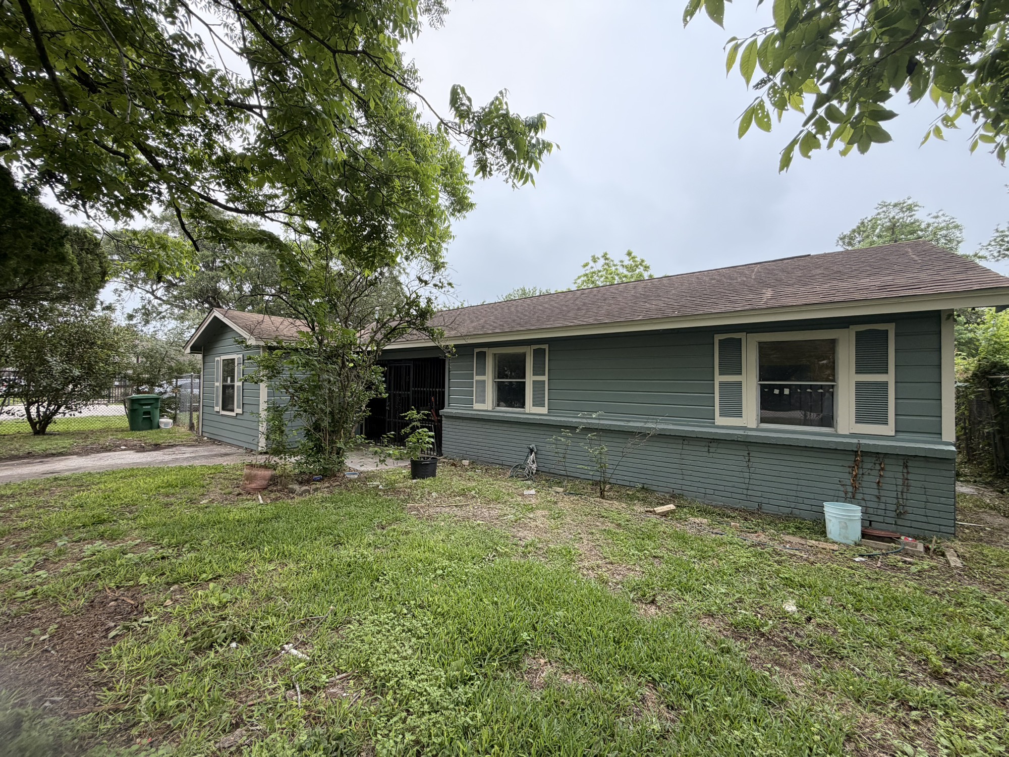 222 East John Alber Road Houston, TX 77037 - Photo 3 of 21 a front view of a house with a garden