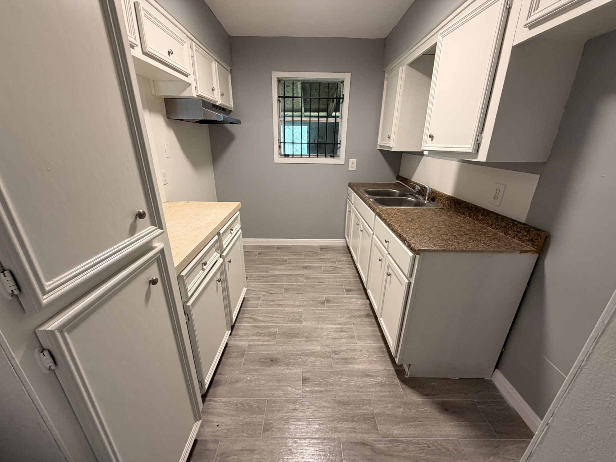 222 East John Alber Road Houston, TX 77037 - Photo 4 of 21 a kitchen with sink window and refrigerator