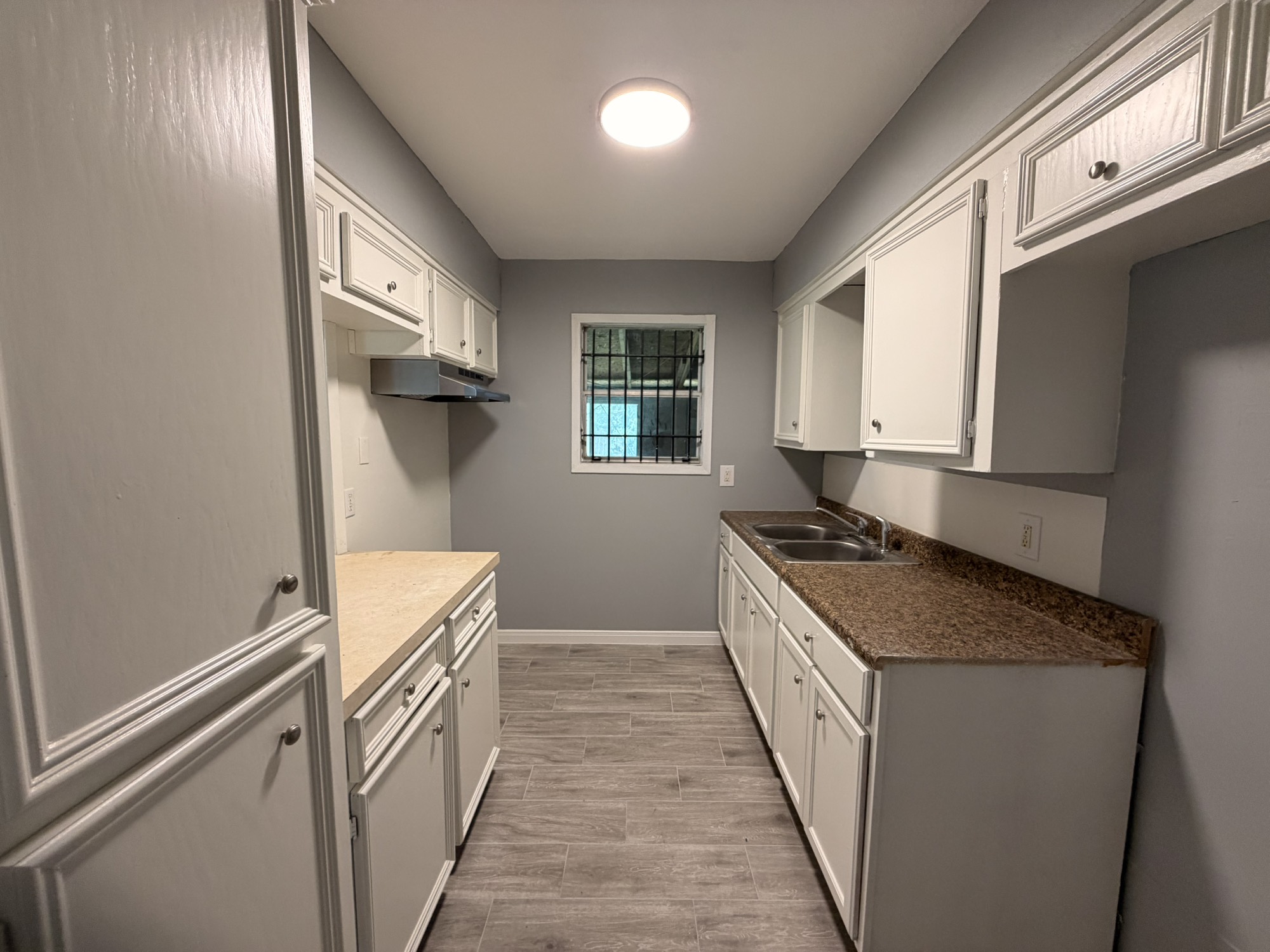 222 East John Alber Road Houston, TX 77037 - Photo 5 of 21 a kitchen with granite countertop a sink and a stove