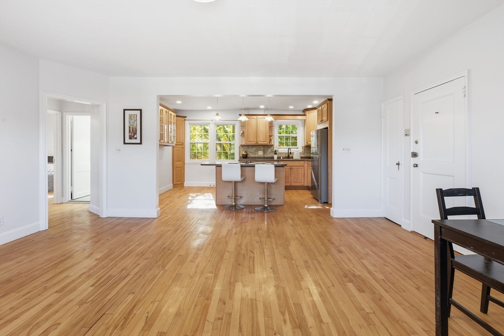 112 Maple Street, Unit 6 Malden, MA 02148 - Photo 9 of 22 a view of a livingroom with furniture window and wooden floor