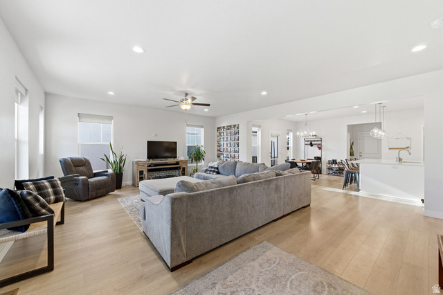 1038 South Old Towne Road Layton, UT 84041 - Photo 9 of 39 Spacious open-concept living area featuring light wood-finish flooring, recessed lighting, and a ceiling fan