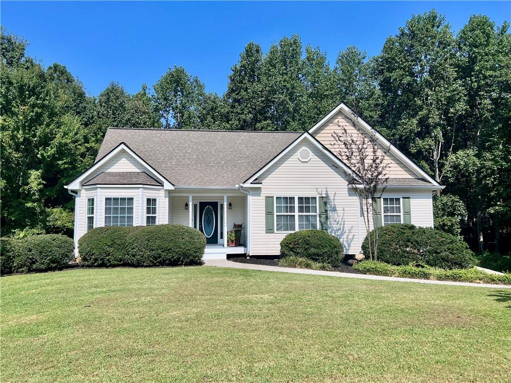 a view of a house next to a yard