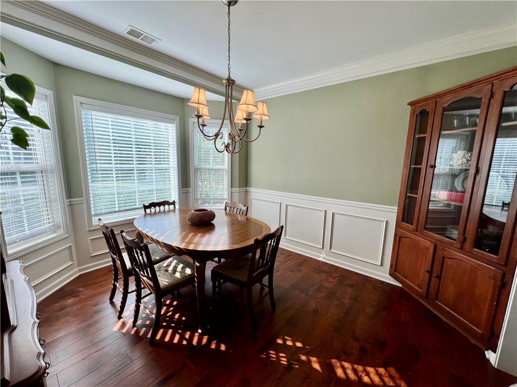 113 Nelson Ridge Drive Ball Ground, GA 30107 - Photo 13 of 33 a view of a dining room with furniture window and wooden floor