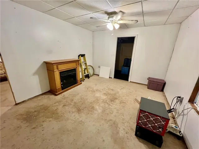 a bedroom with furniture and a fireplace