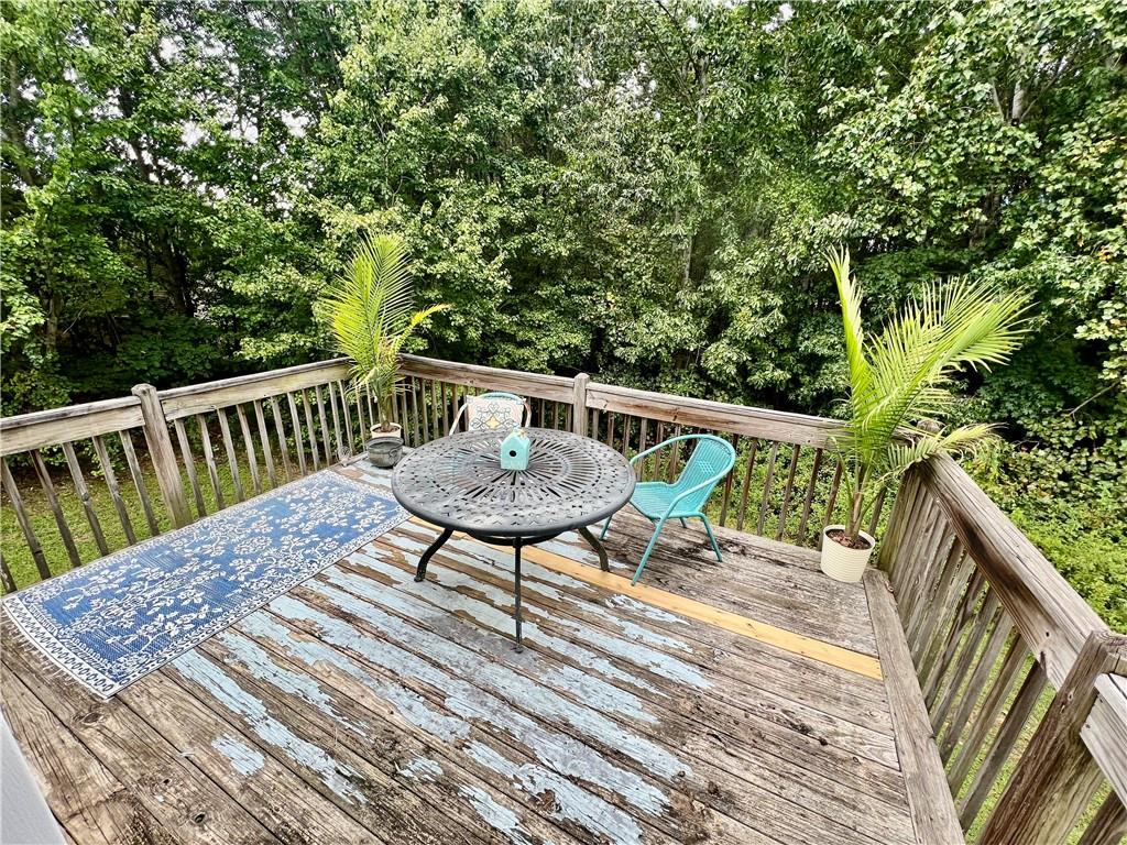 113 Nelson Ridge Drive Ball Ground, GA 30107 - Photo 28 of 33 a view of balcony with wooden floor and outdoor seating