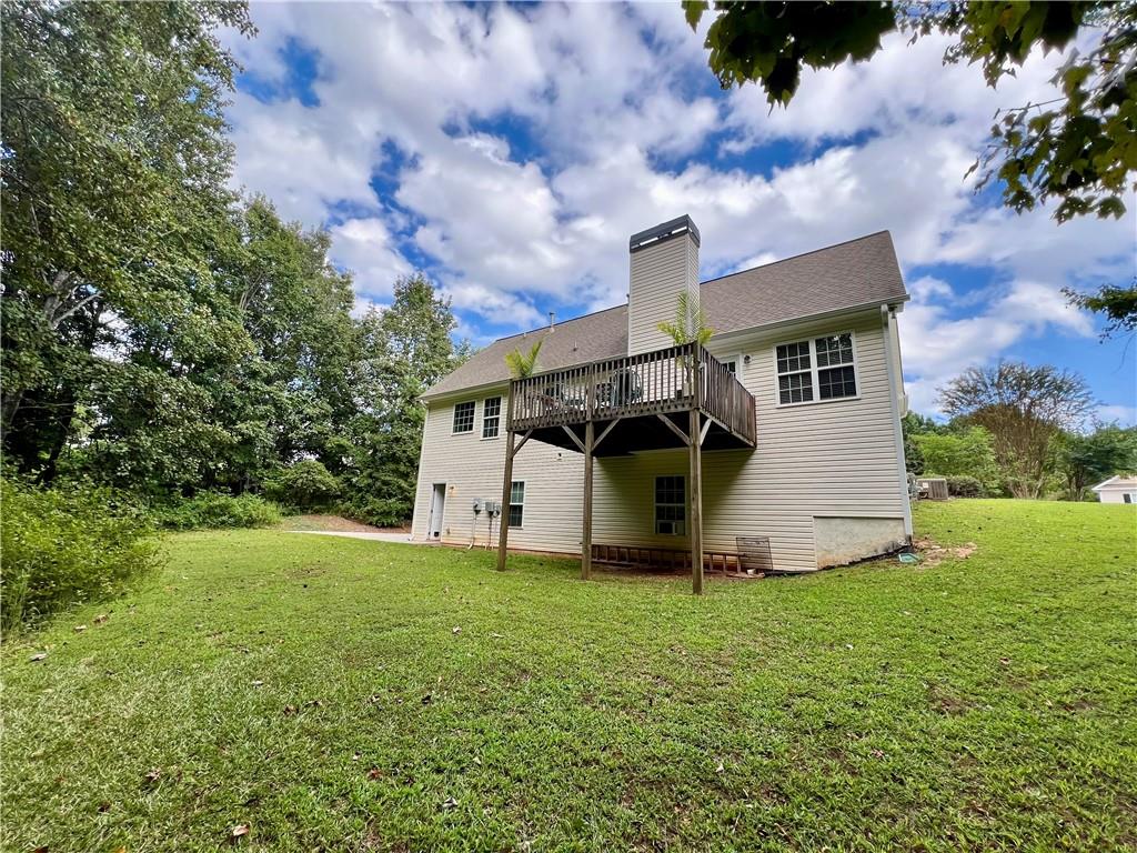 113 Nelson Ridge Drive Ball Ground, GA 30107 - Photo 30 of 33 a front view of a house with garden